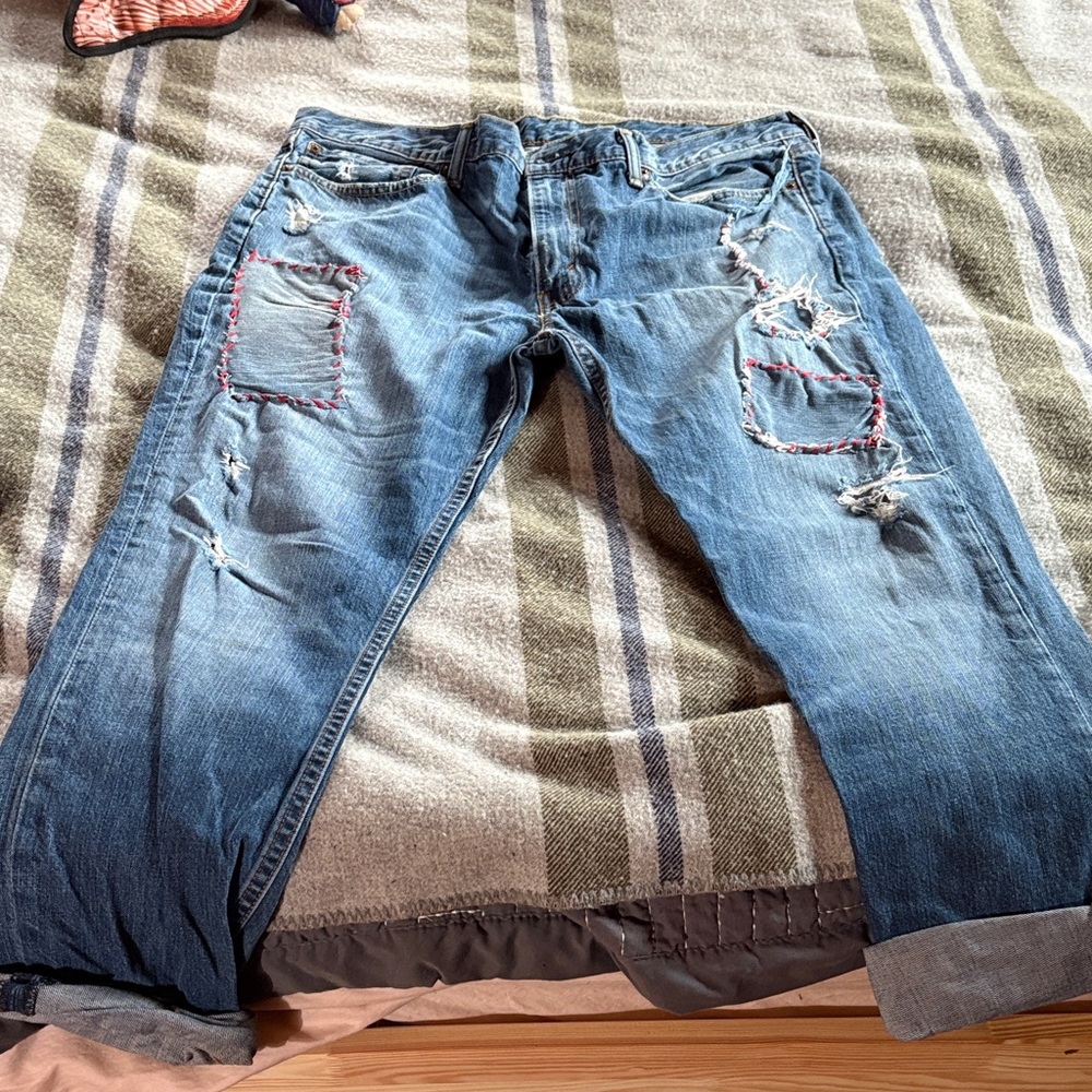 Artist created gender neutral distressed and patched Levi's 511 38x32